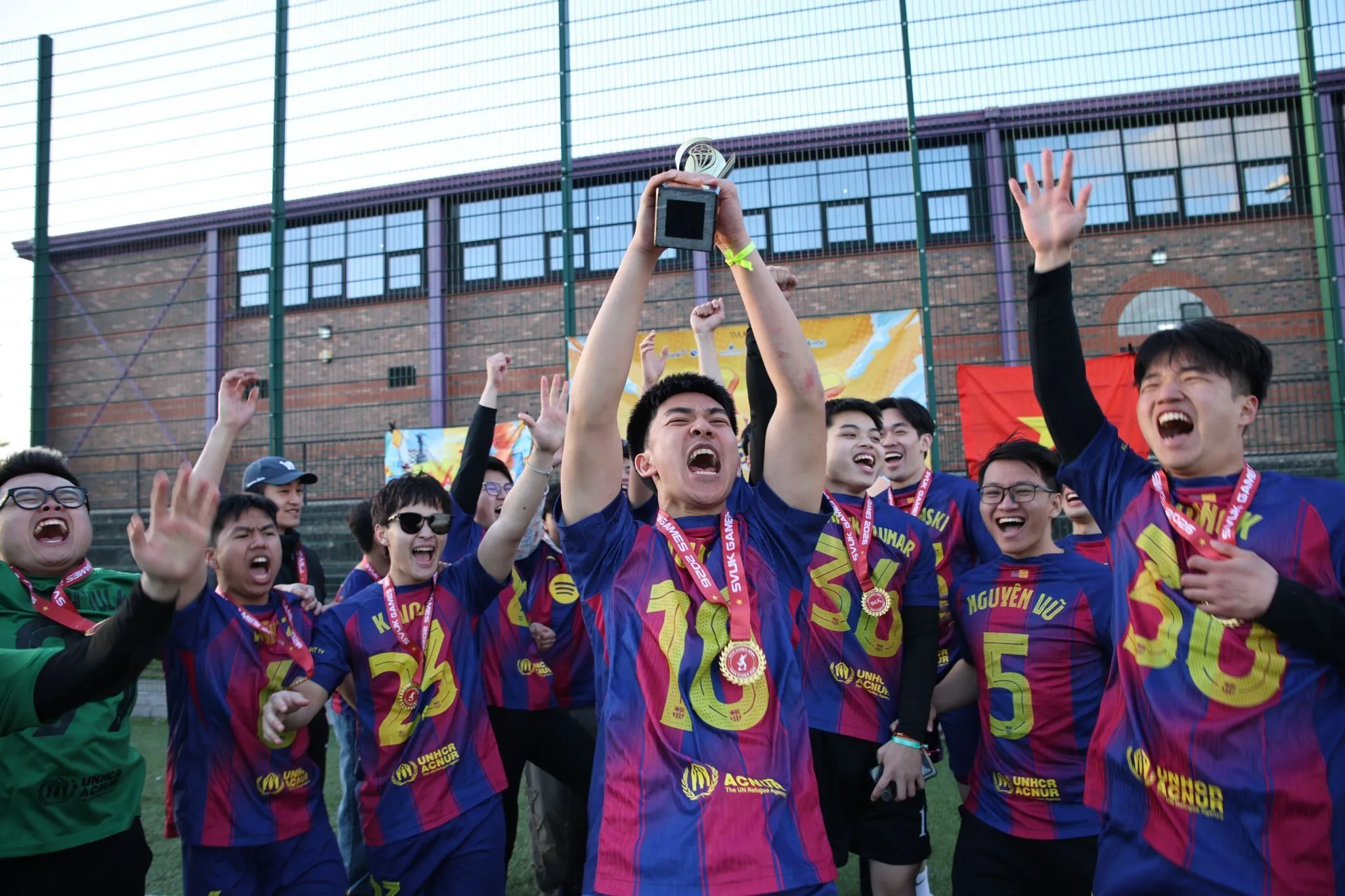 VNS football team celebrating their championship in Manchester